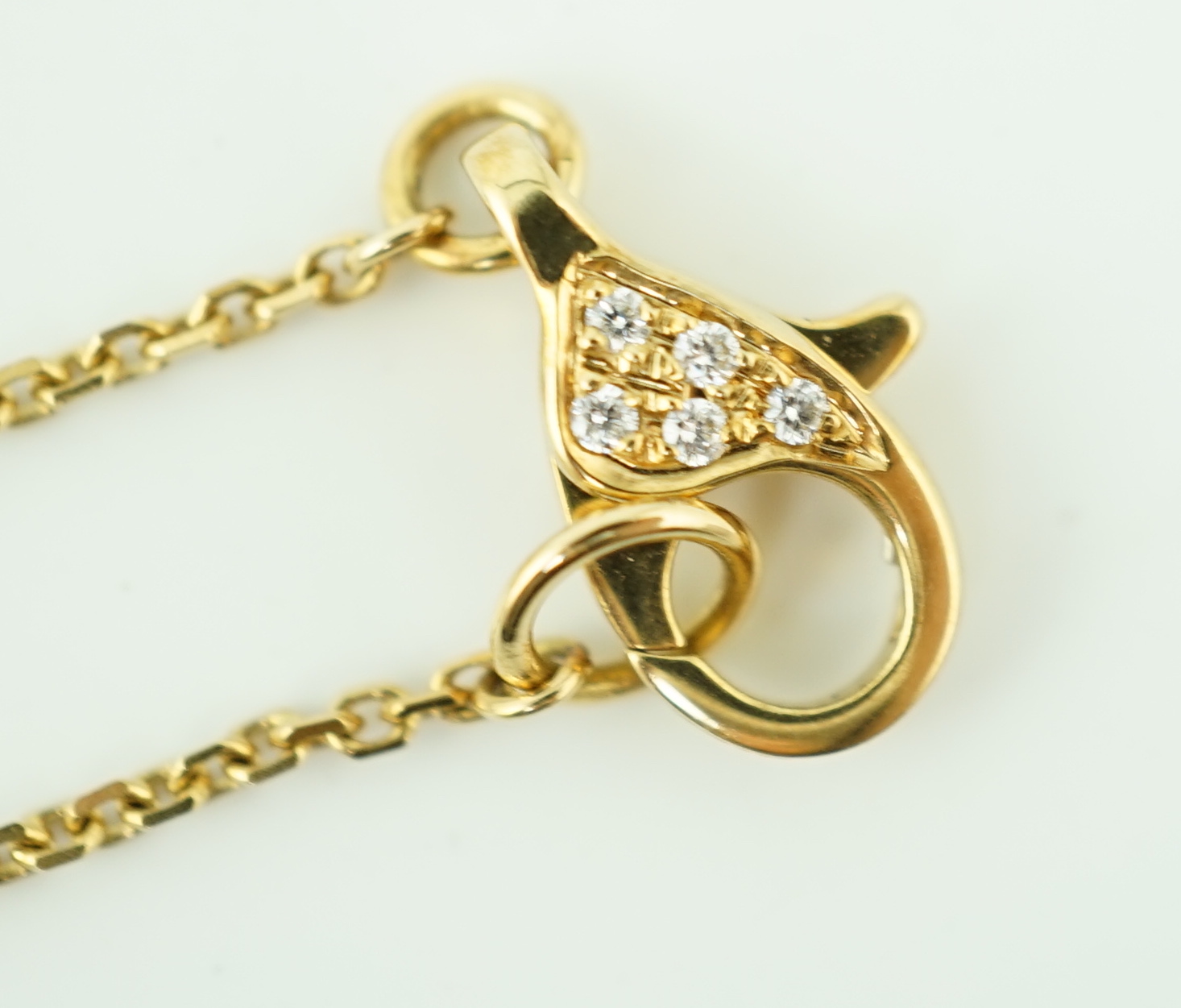 A modern Boodles 18ct gold fancy vivid yellow diamond cluster set pendant necklace on a two stone diamond set chain, with clasp and Boodles ring set with small brilliants